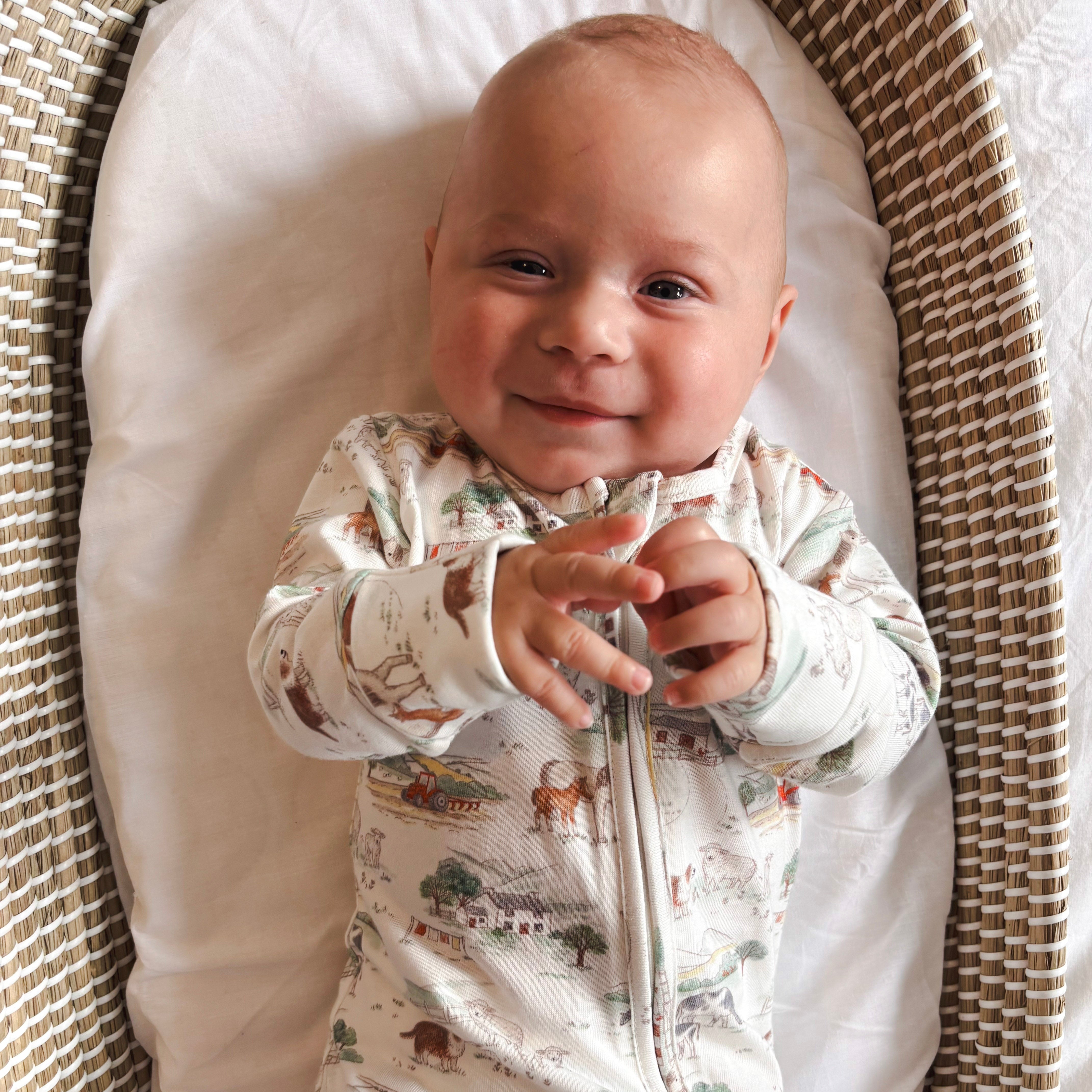 Baby in farm sleepsuit