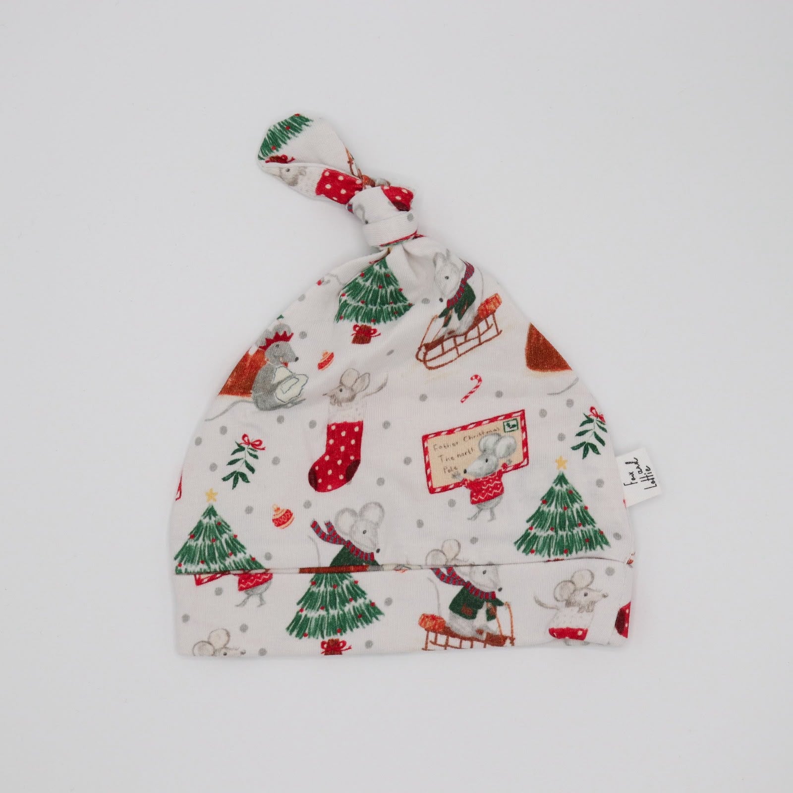 Flat lay of Christmas hat from Fox and Lottie. Perfect for newborns.