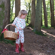 Christmas pyjamas from Fox and Lottie, boy in woods, Christmas scene. Fox and Lottie premium sleepwear for children and babies.
