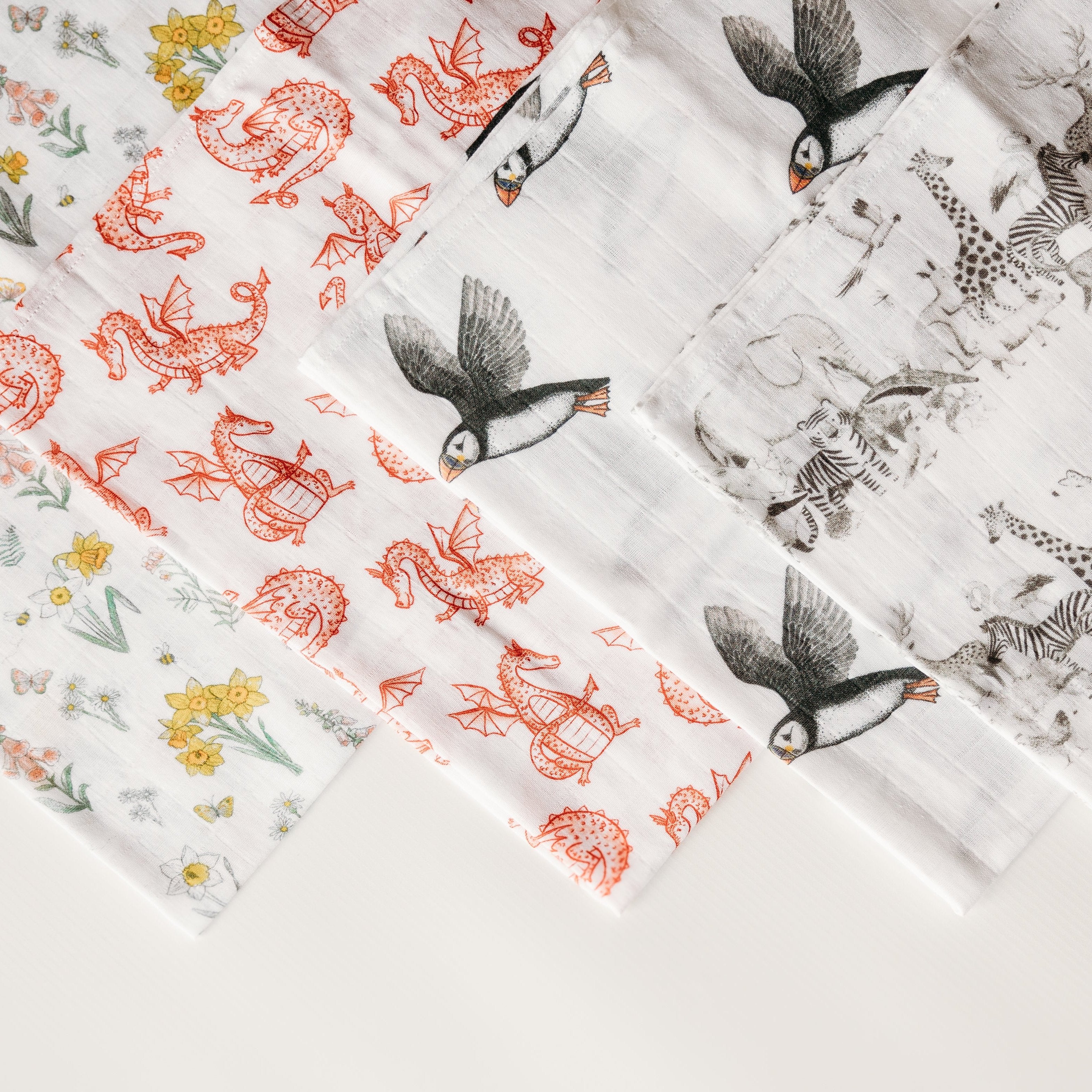 Muslin squares daffodil dragon puffin and animal print. Fox and Lottie premium sleepwear for children and babies. Sleepsuits, blankets, pyjamas, baby hats, muslins.