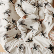 Baby on puffin blanket in puffin sleepsuit. Fox and Lottie baby and children sleepwear