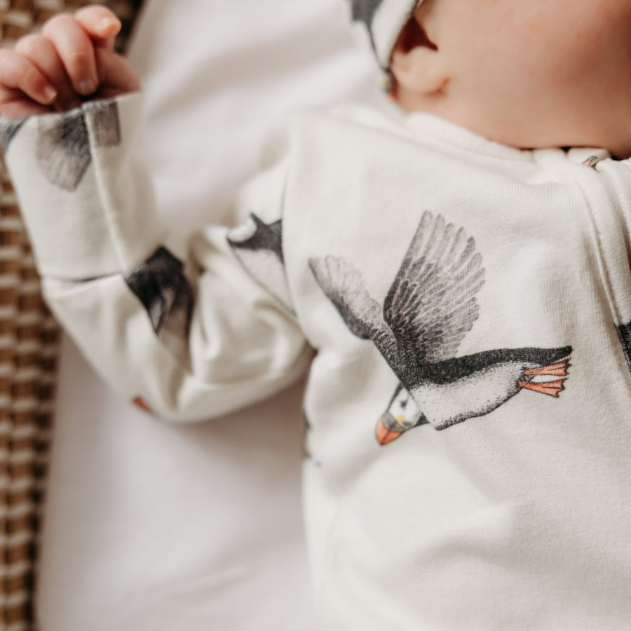 Baby infant in puffin sleepsuit. Fox and Lottie children and baby sleepwear