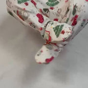 Baby wriggling in Christmas print from Fox and Lottie.